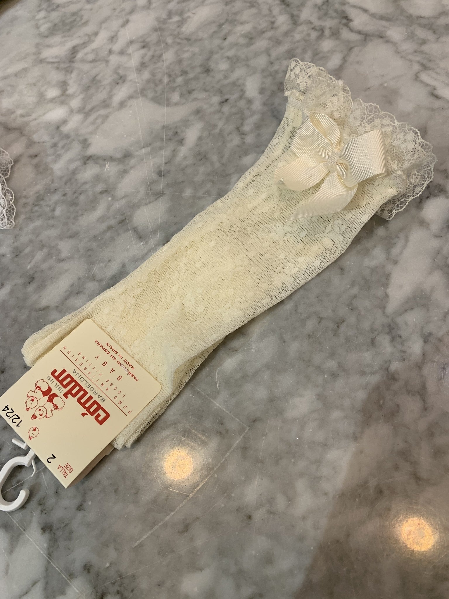 Kanten kniekous met strik CAVA